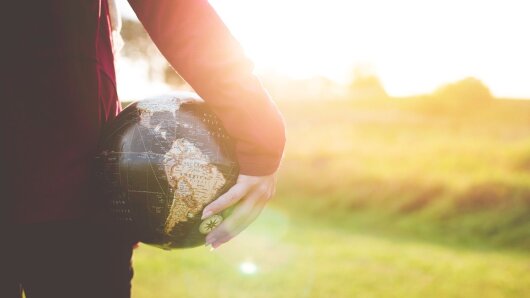 holding a globe