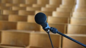 empty lecture hall with focus on microphone